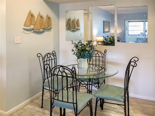 dining space featuring light hardwood / wood-style flooring