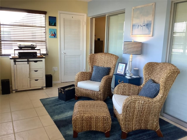 4736 Jasper Dr Unit 207, New Port Richey, FL 34652 - sitting room with baseboards and light tile patterned floors