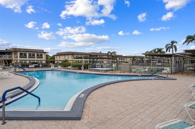 4736 Jasper Dr Unit 207, New Port Richey, FL 34652 - pool with fence and a patio area