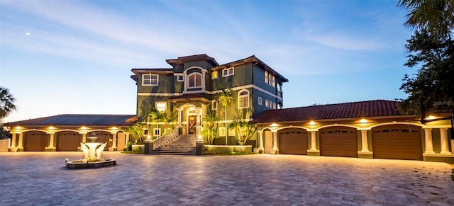 mediterranean / spanish-style house featuring a garage