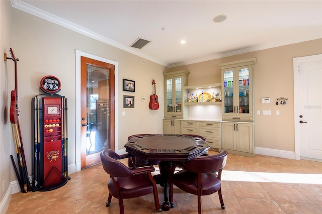 tiled dining room with ornamental molding