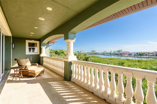 balcony featuring a water view