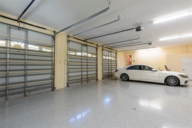 garage featuring a garage door opener