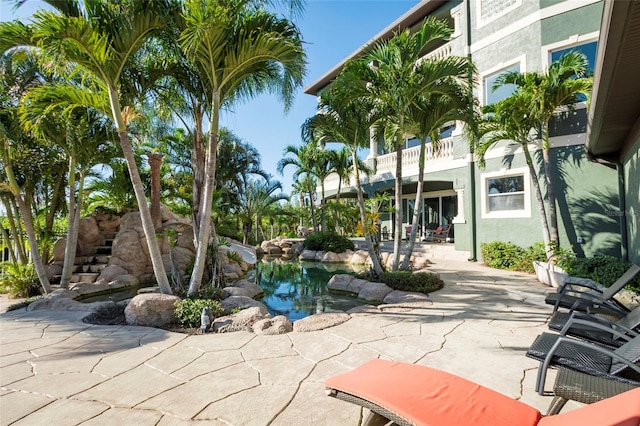 view of home's community with a patio