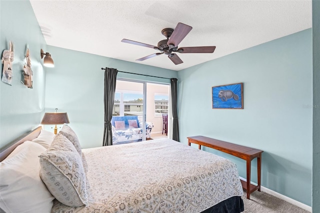 bedroom with carpet, a textured ceiling, and ceiling fan