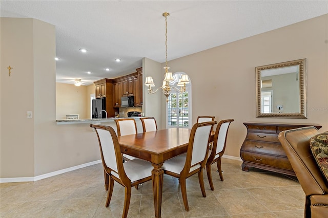 dining room with an inviting chandelier and light tile flooring