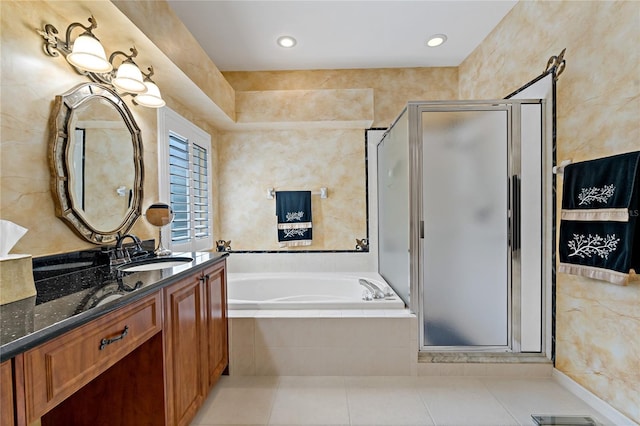 bathroom featuring tile floors, tile walls, and independent shower and bath