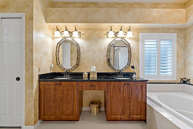 bathroom featuring tile floors, a relaxing tiled bath, and double vanity