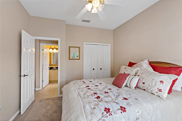 bedroom with a closet, ceiling fan, and light tile floors