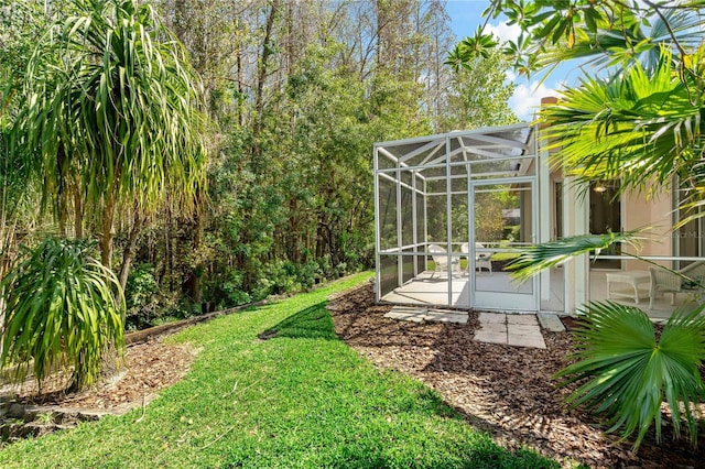 view of yard with a lanai