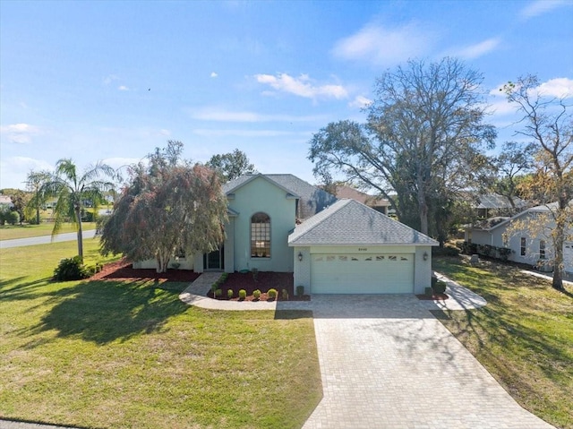 view of front of house featuring a front lawn and a garage