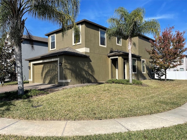 view of front of property with a front lawn and a garage