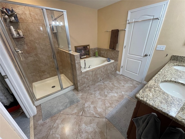 bathroom featuring tile flooring, double vanity, and separate shower and tub