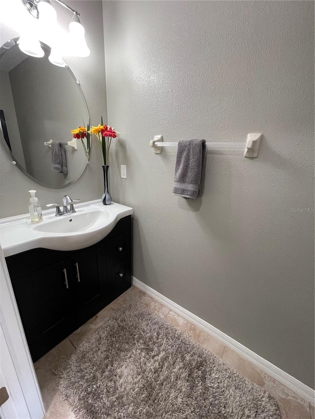 bathroom with vanity and tile floors