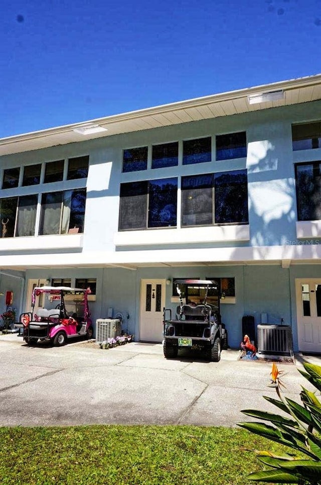 view of building exterior featuring central air condition unit