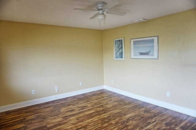 unfurnished room featuring dark hardwood / wood-style flooring and ceiling fan