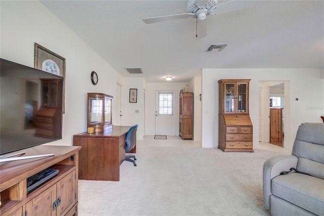 office space with light carpet and ceiling fan