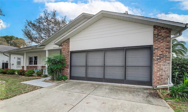 view of front of home featuring covered porch and a garage