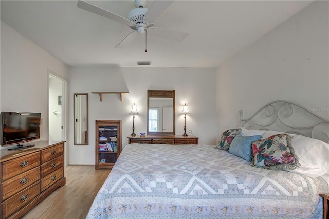 bedroom with light hardwood / wood-style floors and ceiling fan