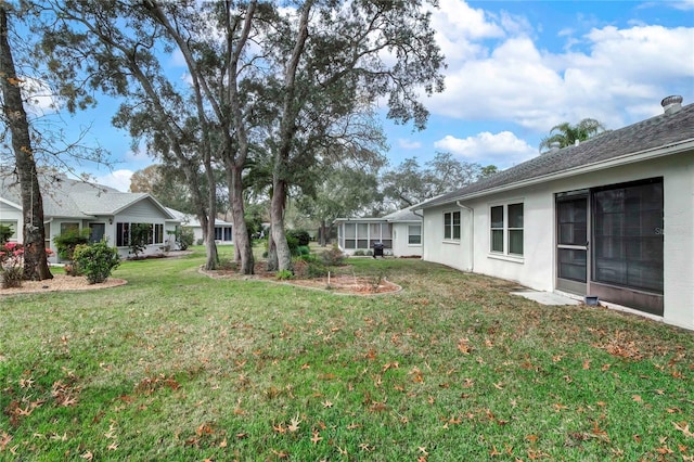 view of yard with a sunroom