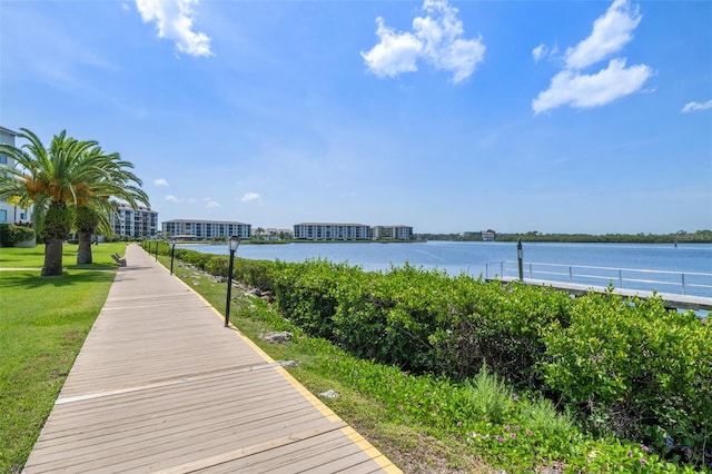 exterior space with a lawn and a water view