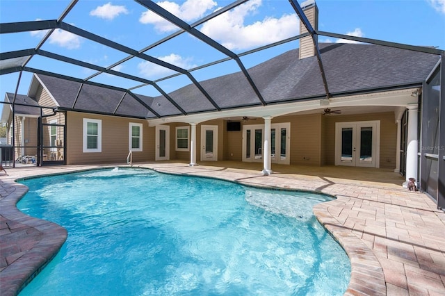 pool with a patio, french doors, glass enclosure, and a ceiling fan