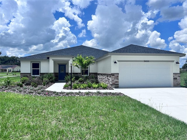 view of front of house featuring a garage and a front yard