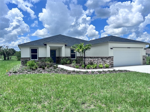 view of front of home featuring a garage and a front yard