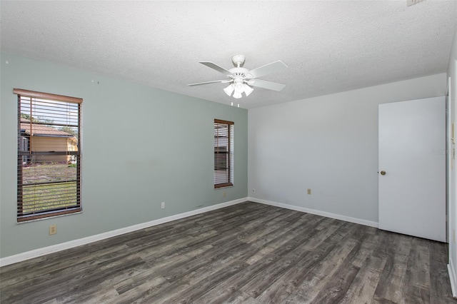 unfurnished room with a textured ceiling, dark hardwood / wood-style floors, and ceiling fan