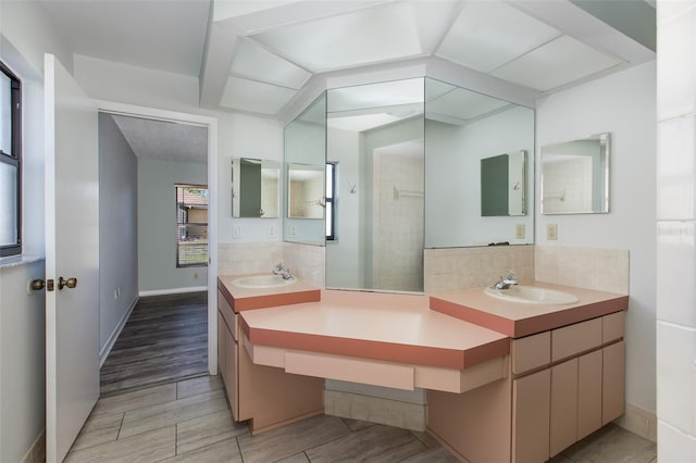 bathroom featuring vanity, tile floors, and tasteful backsplash