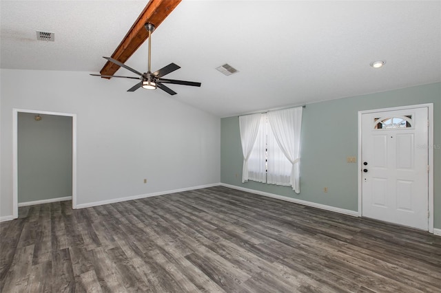 unfurnished room featuring dark hardwood / wood-style flooring, ceiling fan, and lofted ceiling with beams