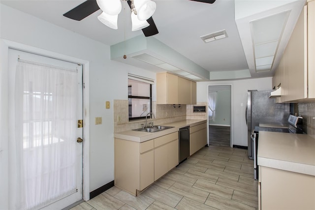 kitchen featuring range with electric stovetop, ceiling fan, tasteful backsplash, dishwasher, and sink