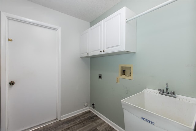 washroom with electric dryer hookup, washer hookup, cabinets, dark hardwood / wood-style flooring, and sink