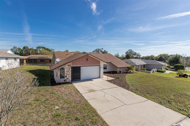 ranch-style home featuring a front lawn and a garage