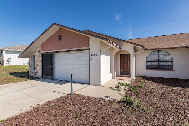 ranch-style home featuring a garage