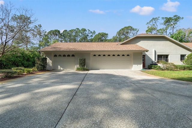 ranch-style house featuring a garage