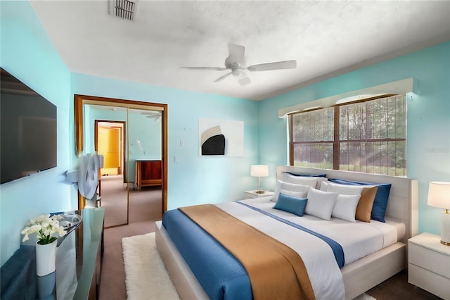 bedroom with ceiling fan, a closet, and carpet floors