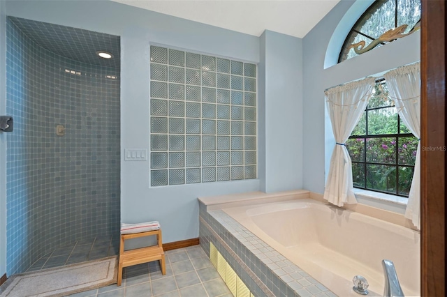 bathroom with tile patterned flooring and plus walk in shower