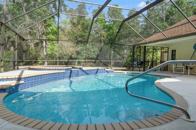 view of pool with a jacuzzi, a lanai, and a patio