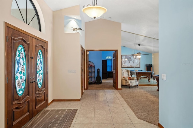 foyer entrance featuring lofted ceiling, french doors, ceiling fan, pool table, and light colored carpet