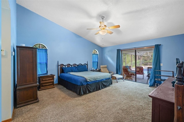 bedroom featuring ceiling fan, access to exterior, lofted ceiling, and carpet floors