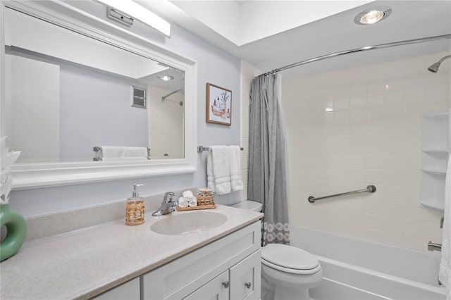 full bathroom featuring toilet, shower / tub combo, visible vents, and vanity