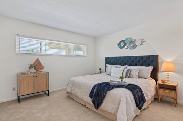 carpeted bedroom with multiple windows and baseboards