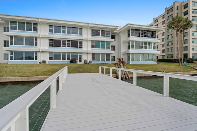 dock area featuring a lawn