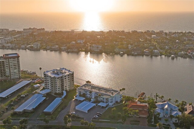 birds eye view of property with a water view and a city view