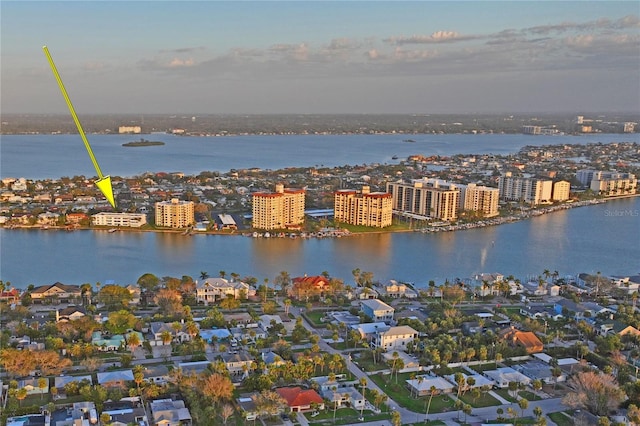 drone / aerial view featuring a water view and a city view