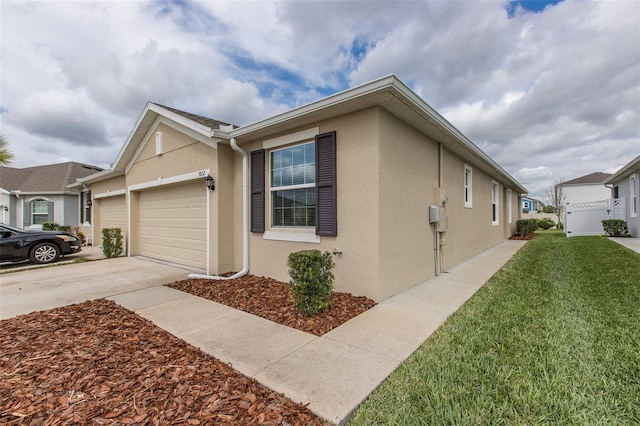 view of front of house with a front yard and a garage