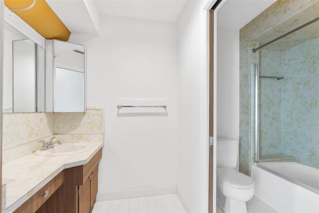 full bathroom featuring vanity, tile patterned flooring, tiled shower / bath combo, decorative backsplash, and toilet