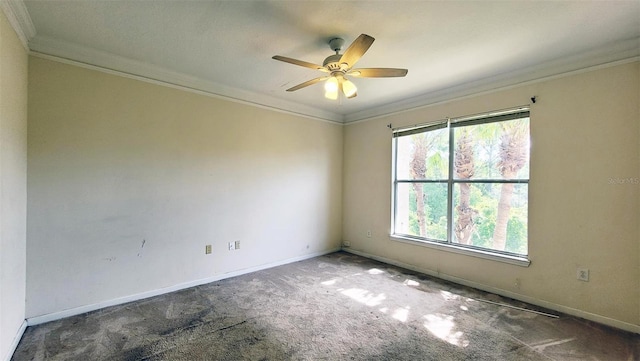 carpeted empty room featuring crown molding and ceiling fan