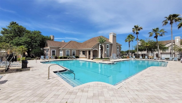 view of swimming pool featuring a patio